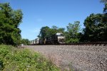 NS 9932 and 4243 take train 260 east at Cove PA
